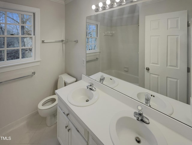 full bathroom with tile patterned floors, toilet, ornamental molding, and a wealth of natural light