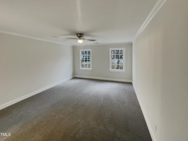 carpeted spare room featuring ceiling fan and crown molding