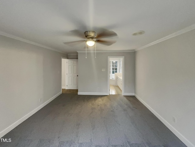 carpeted spare room with ceiling fan and crown molding