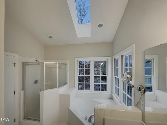 bathroom with vaulted ceiling with skylight and plus walk in shower