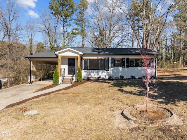 ranch-style house with a carport and a front lawn