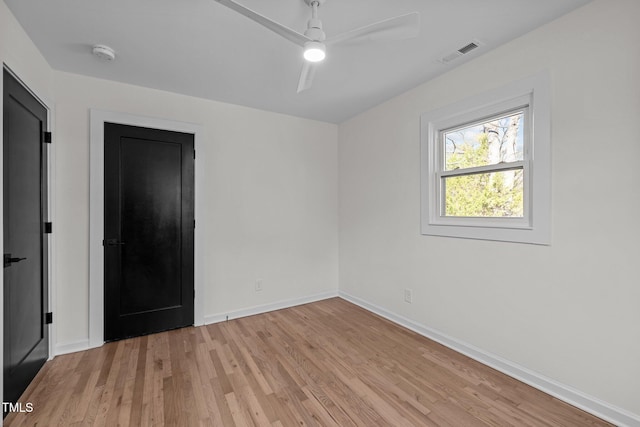 spare room with ceiling fan and light hardwood / wood-style flooring