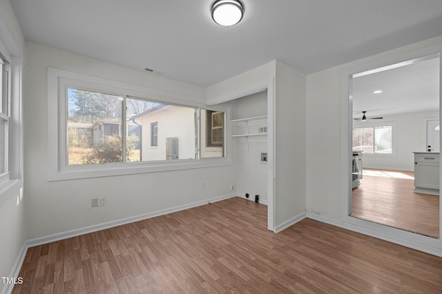 spare room with light wood-type flooring