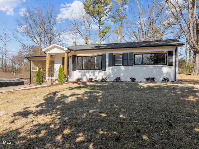 ranch-style house with a front yard and a porch