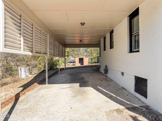 view of patio with a storage shed