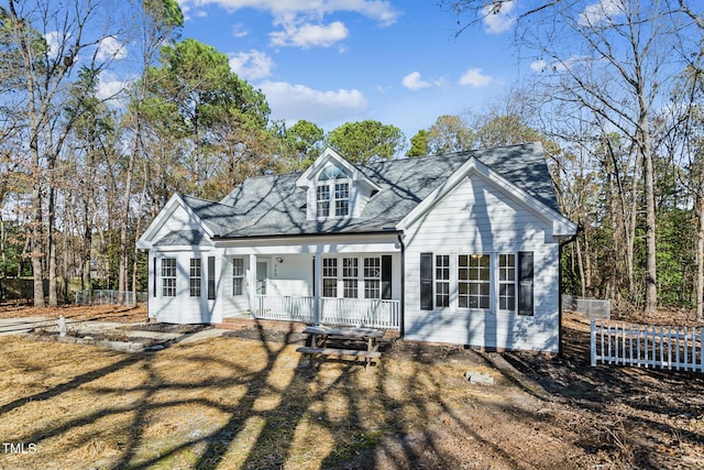 back of house featuring a porch