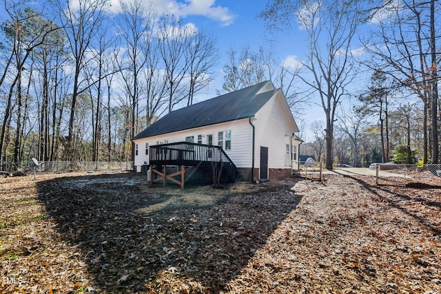 view of side of home featuring a deck