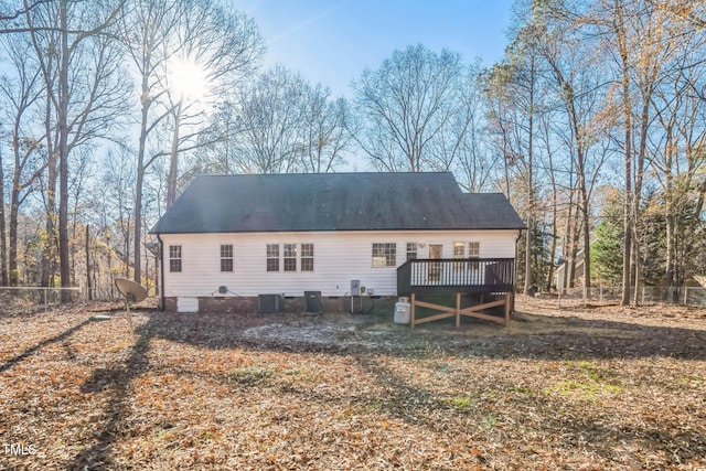 back of property featuring a deck and central air condition unit