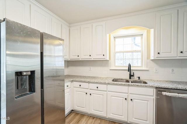 kitchen with white cabinets, sink, and appliances with stainless steel finishes