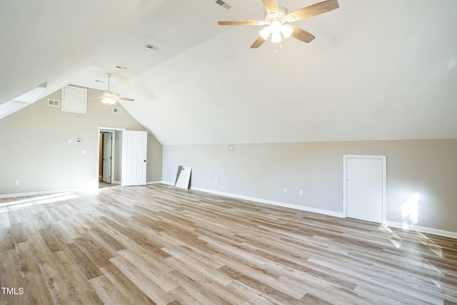 additional living space featuring ceiling fan, lofted ceiling, and light wood-type flooring