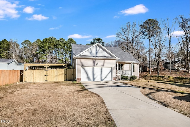 view of front of property with covered porch and a garage