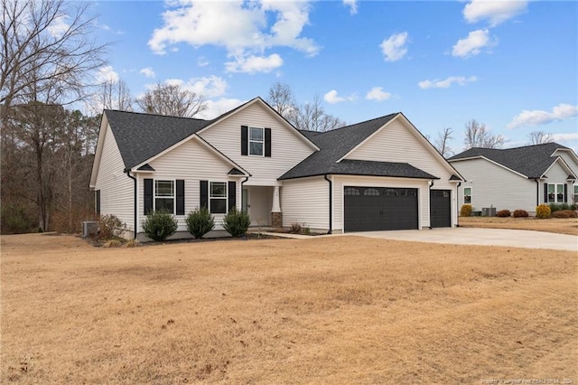 view of front property featuring a front yard and a garage