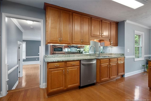 kitchen featuring light stone countertops, crown molding, stainless steel dishwasher, and light wood-type flooring