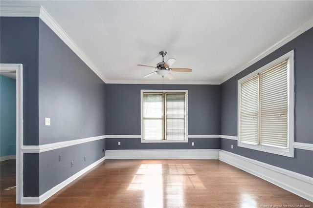 spare room with ceiling fan, wood-type flooring, and ornamental molding