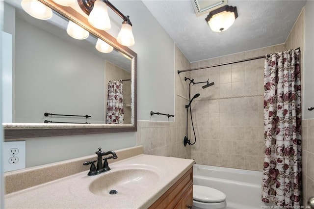 full bathroom with vanity, toilet, and shower / bath combo with shower curtain