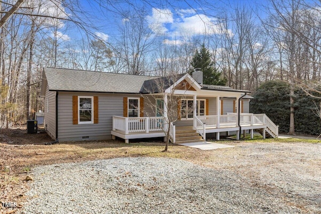 view of front of house with central AC and a porch