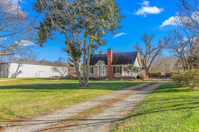 cape cod-style house with a front lawn