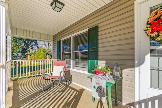 wooden deck featuring covered porch