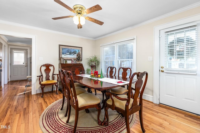 dining area featuring light hardwood / wood-style flooring, ceiling fan, and ornamental molding