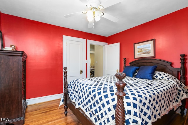 bedroom with hardwood / wood-style flooring and ceiling fan