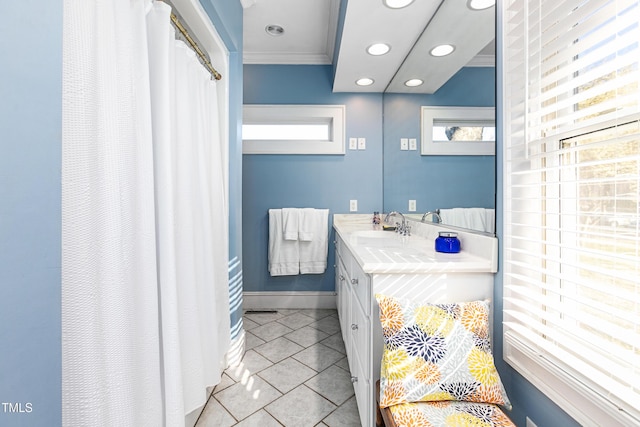 bathroom featuring tile patterned flooring, vanity, and ornamental molding