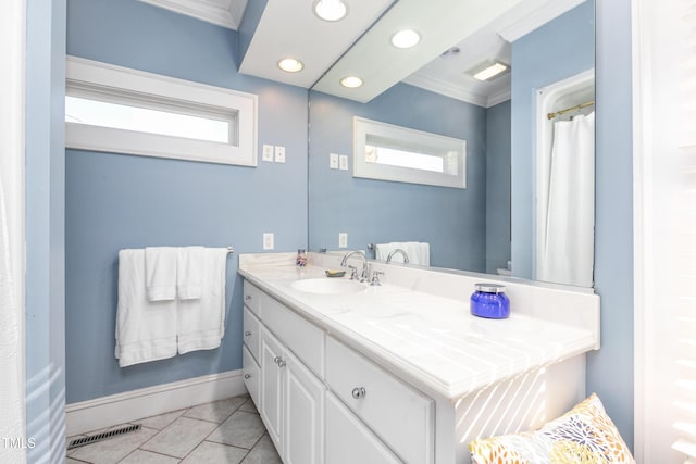 bathroom featuring vanity, tile patterned floors, and crown molding