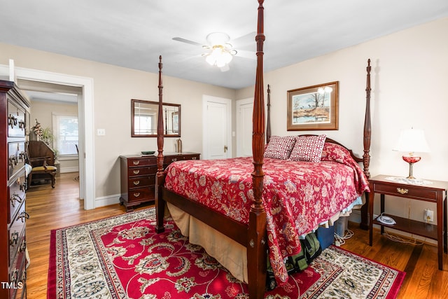 bedroom with ceiling fan and dark wood-type flooring