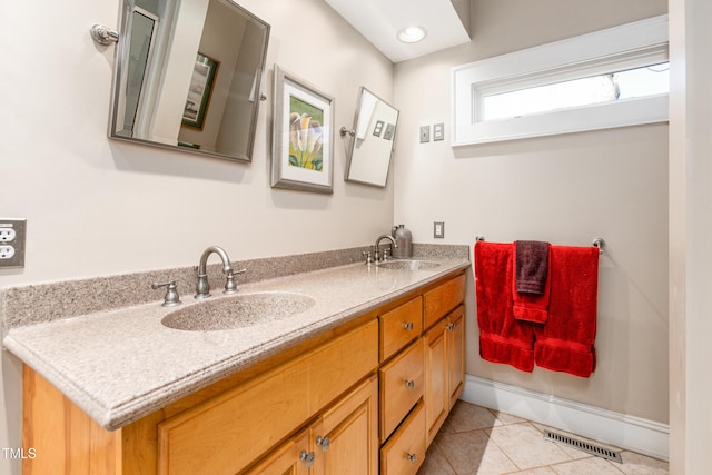 bathroom with tile patterned flooring and vanity