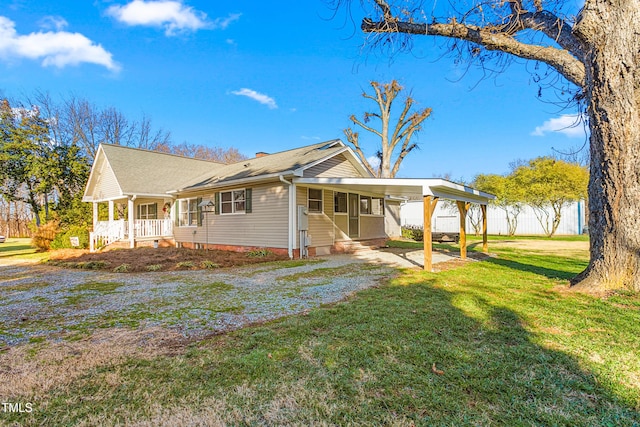 view of property exterior featuring a carport and a lawn