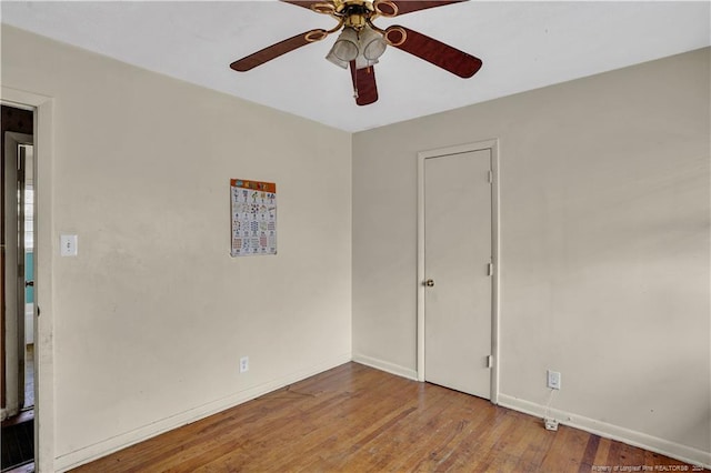 unfurnished room featuring hardwood / wood-style flooring and ceiling fan