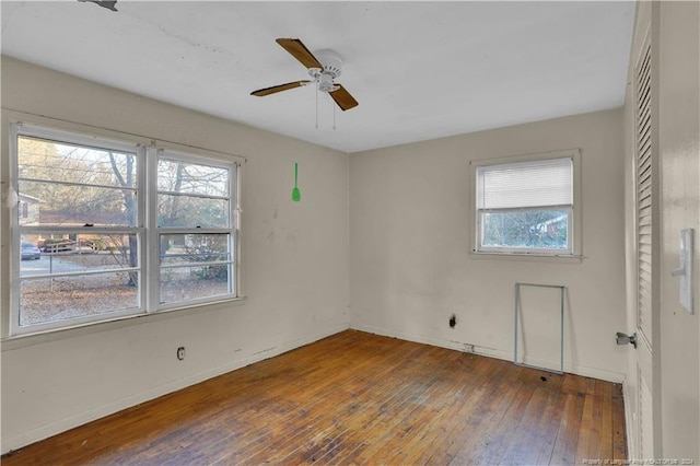 spare room featuring ceiling fan and hardwood / wood-style flooring