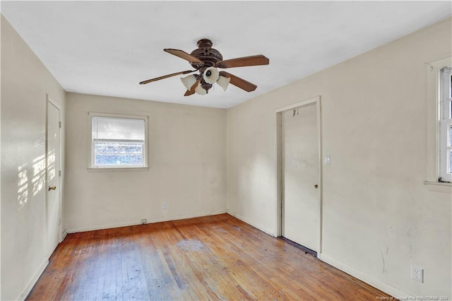 unfurnished room featuring ceiling fan and light wood-type flooring