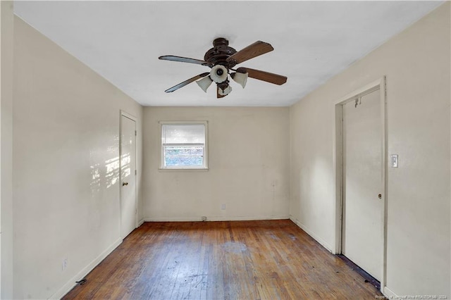 unfurnished room with hardwood / wood-style flooring and ceiling fan