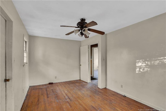 spare room with wood-type flooring and ceiling fan