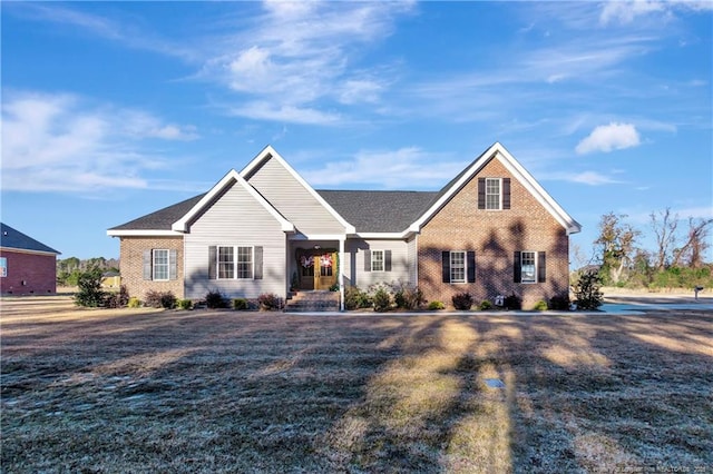 view of front of house with brick siding