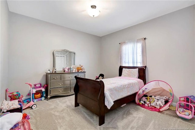 bedroom featuring light carpet