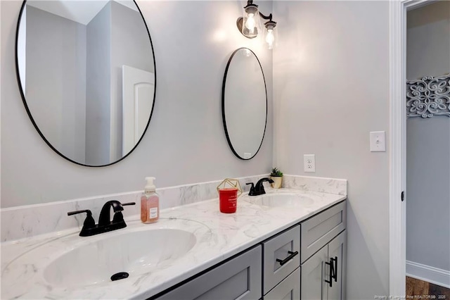 bathroom with double vanity and a sink