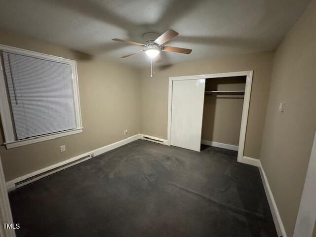 unfurnished bedroom featuring a closet, a baseboard radiator, and ceiling fan