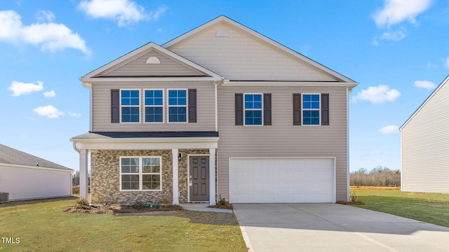 view of front of property with central AC unit, a garage, and a front lawn