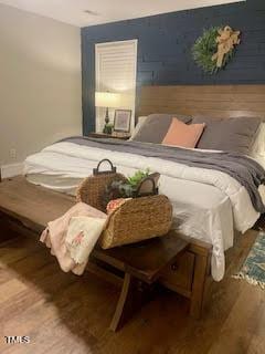 bedroom featuring hardwood / wood-style flooring