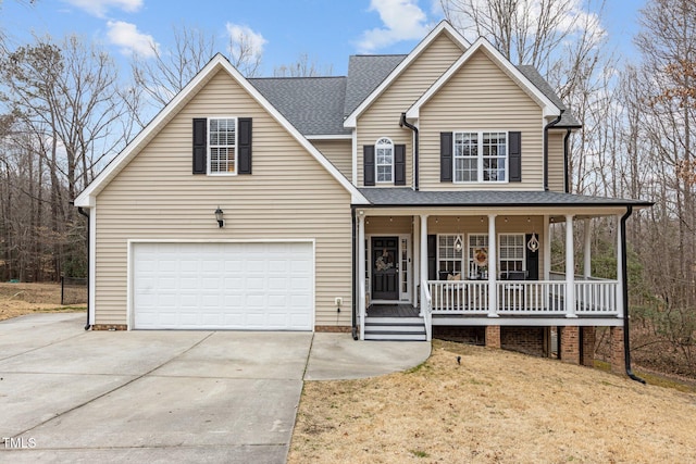 view of front facade with a porch, a garage, and a front yard