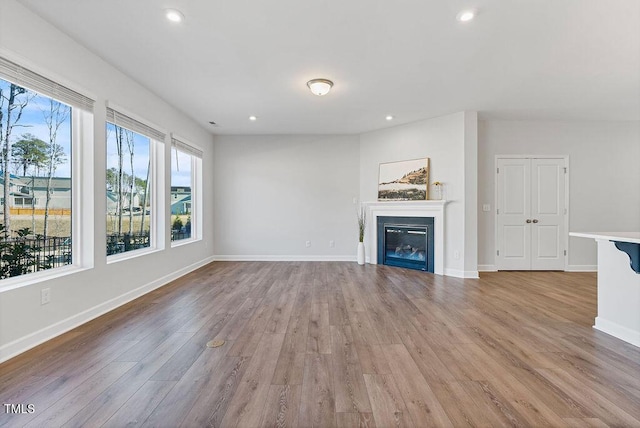 unfurnished living room featuring light wood-type flooring