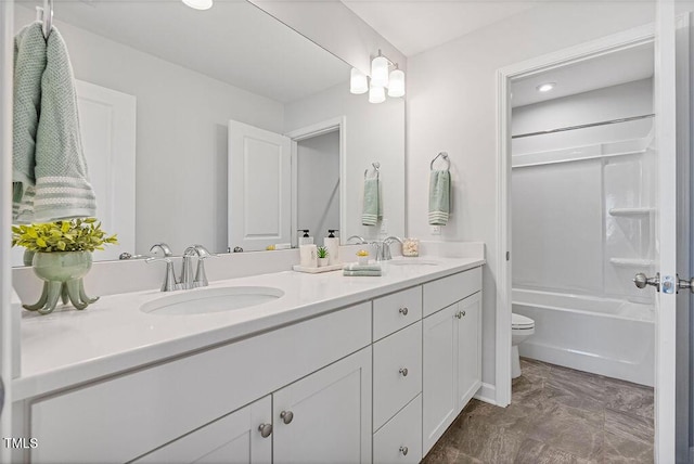 full bathroom featuring shower / washtub combination, vanity, and toilet