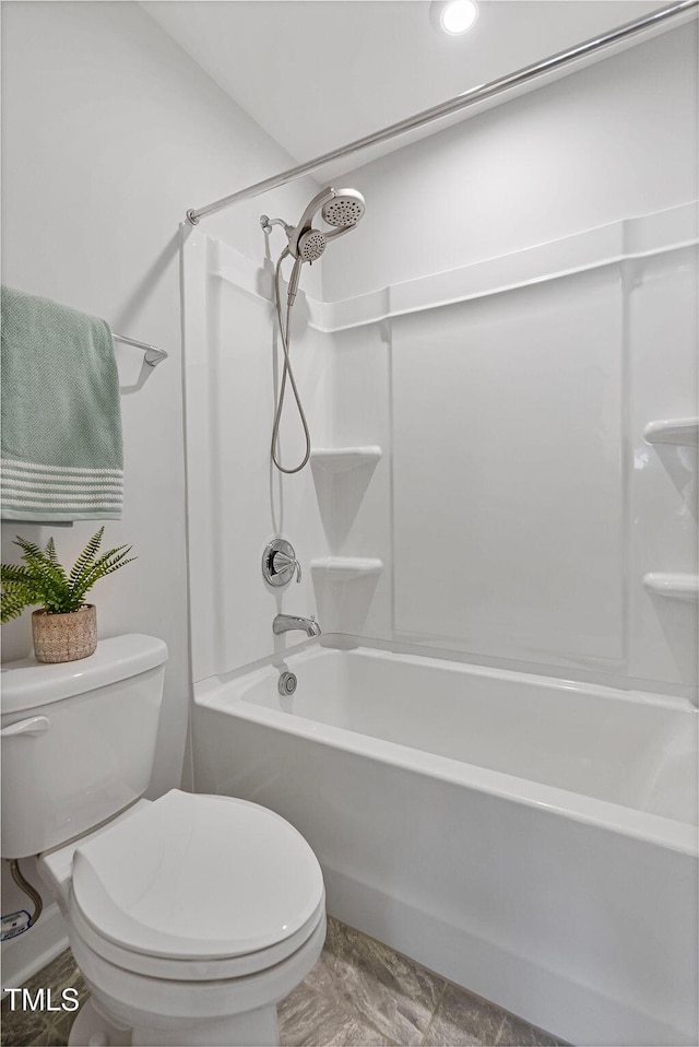 bathroom with shower / bathtub combination and toilet