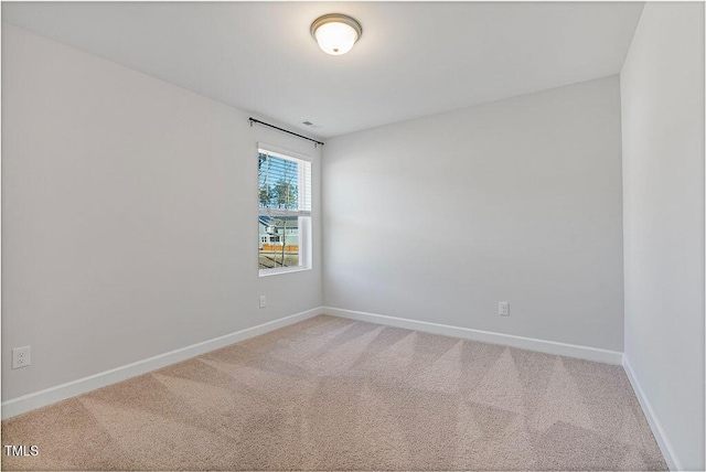 unfurnished room featuring carpet