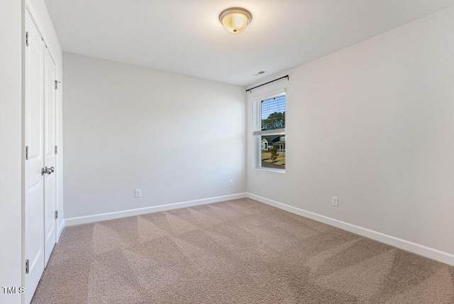 spare room with carpet floors