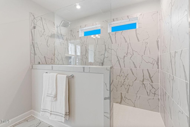 bathroom with a tile shower