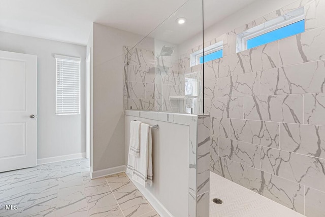 bathroom with a tile shower