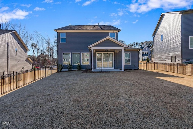 back of property with ceiling fan