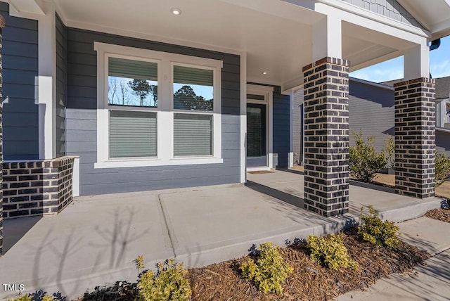 property entrance with covered porch